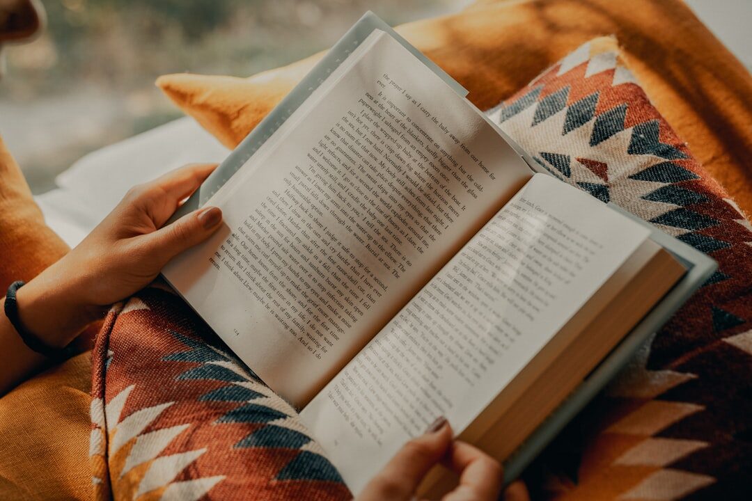person reading thriller book